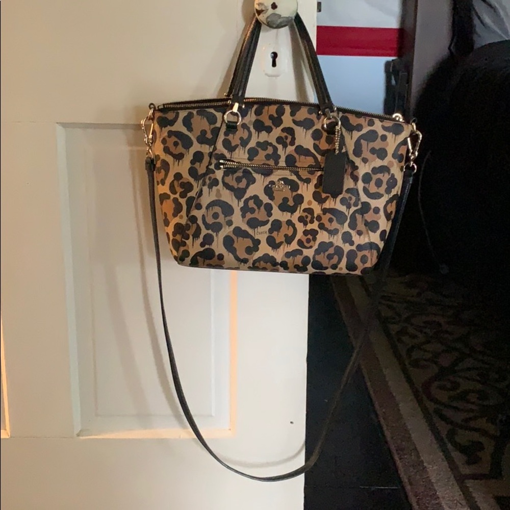 Coach Ocelot leopard print crossbody purse.